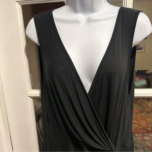 Black blouse, sleeveless, v- neck, rayon, with a little gathering on the hip